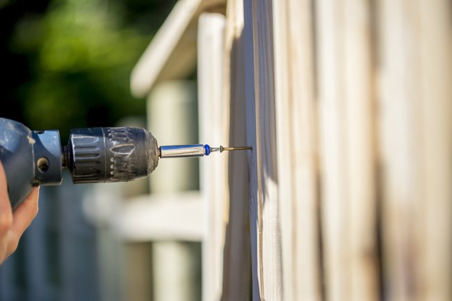 a person using drill machine