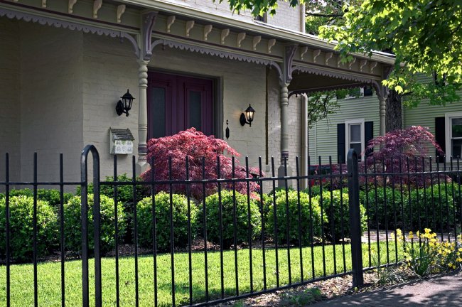 metal fencing and house