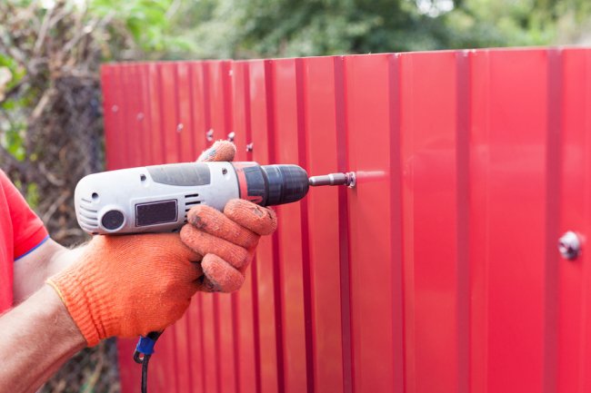 a man installing fences