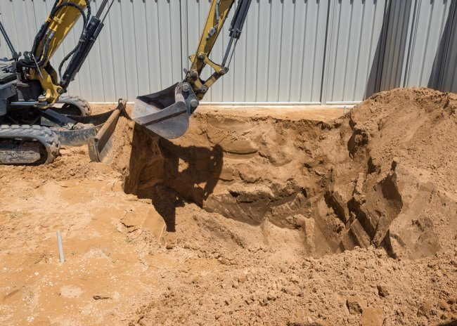 A-1 Fence Inc. team is digging a yard to install a new chain link fence in San Jose, CA 